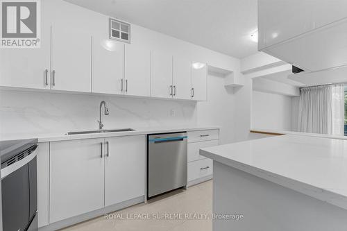 New Full Slab Counter/Backsplash - 107 - 270 Scarlett Road, Toronto, ON - Indoor Photo Showing Kitchen