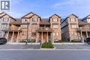 View of property with uncovered parking - 85 Mullin Drive Unit# 20B, Guelph, ON  - Outdoor With Facade 