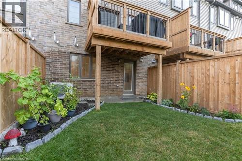 View of exterior entry featuring brick siding and a patio - 85 Mullin Drive Unit# 20B, Guelph, ON - Outdoor With Exterior