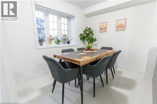 Dining space with baseboards and light tile patterned flooring - 85 Mullin Drive Unit# 20B, Guelph, ON - Indoor Photo Showing Dining Room