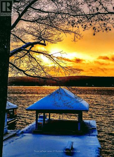 Sunset at the dock - 307 - 12 Bigwin Island Island, Lake Of Bays (Franklin), ON - Outdoor With Body Of Water With View