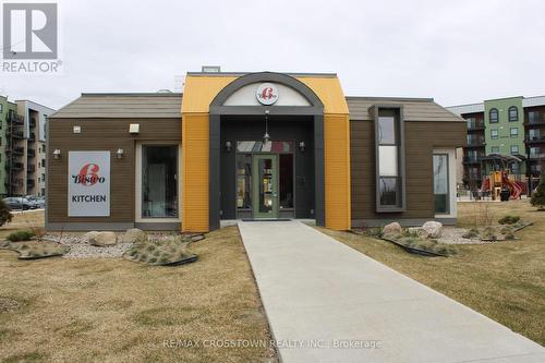 408 - 6 Spice Way, Barrie, ON - Outdoor With Facade