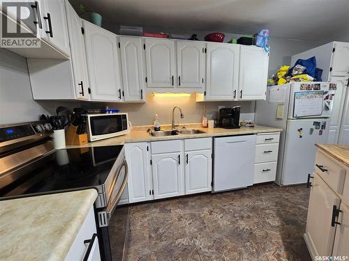 7 Mitchell Crescent, Weyburn, SK - Indoor Photo Showing Kitchen With Double Sink