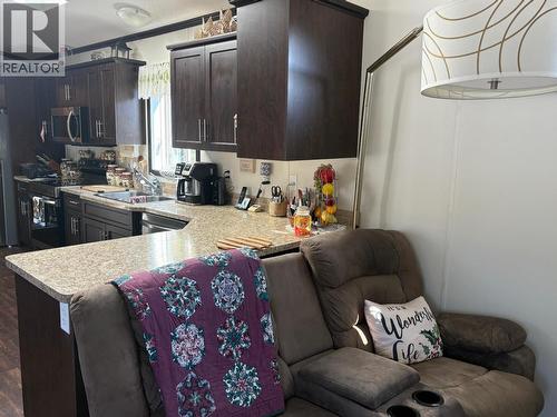 54 208 8Th Street, 100 Mile House, BC - Indoor Photo Showing Kitchen With Double Sink