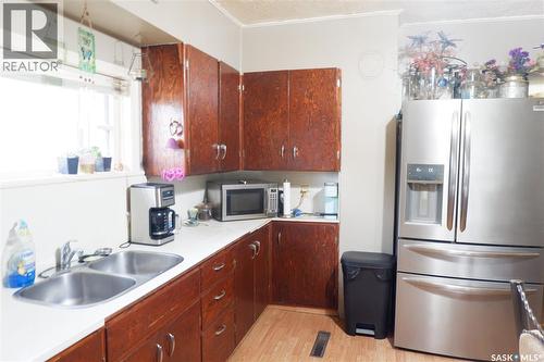 221 7Th Avenue W, Assiniboia, SK - Indoor Photo Showing Kitchen With Double Sink