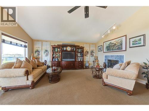 343 Stellar Drive, Kelowna, BC - Indoor Photo Showing Living Room With Fireplace