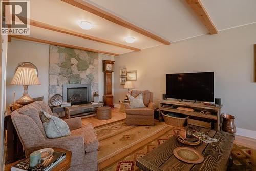 5058 Block Drive, 108 Mile Ranch, BC - Indoor Photo Showing Living Room With Fireplace