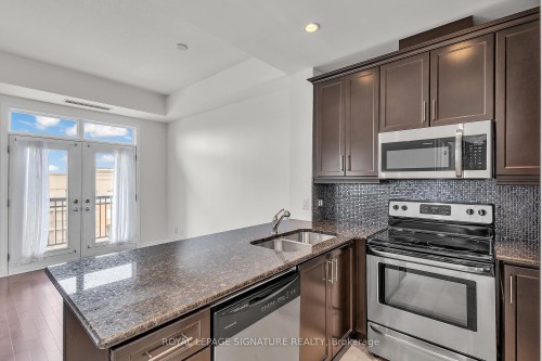 504-5327 Upper Middle Road W, Burlington, ON - Indoor Photo Showing Kitchen With Stainless Steel Kitchen With Double Sink With Upgraded Kitchen
