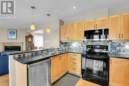 229 Mistral Way, Ottawa, ON - Indoor Photo Showing Kitchen With Fireplace With Double Sink