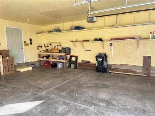 81 Mockingbird Drive, Brandon, MB - Indoor Photo Showing Garage