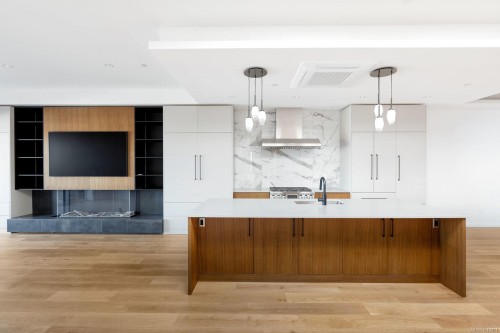 201-2270 Harbour Rd, Sidney, BC - Indoor Photo Showing Kitchen With Fireplace
