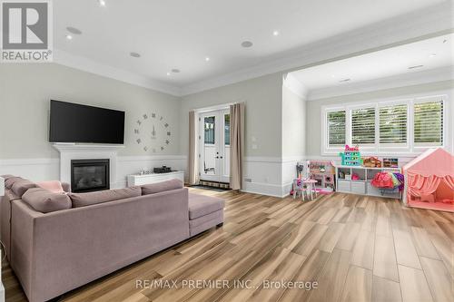 LL Family Room - 111 Codsell Avenue, Toronto, ON - Indoor Photo Showing Living Room With Fireplace
