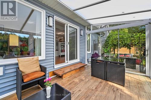 Three-Season Glass Sunroom off Family Room - 666 Cedar Avenue, Burlington, ON - Outdoor With Deck Patio Veranda