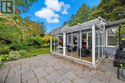 Three-Season Glass Sunroom off Family Room - 666 Cedar Avenue, Burlington, ON - Outdoor With Deck Patio Veranda