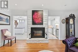 Living Room with Hardwood Flooring & Gas Fireplace - 