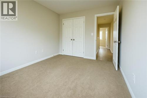 Unfurnished bedroom featuring a closet and carpet - 6 Upper Mercer Street Unit# B6, Kitchener, ON - Indoor Photo Showing Other Room