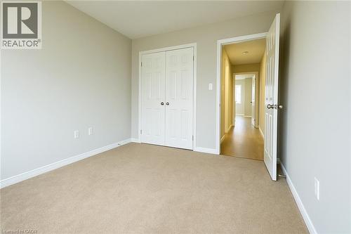 Unfurnished bedroom featuring carpet flooring and a closet - 6 Upper Mercer Street Unit# B6, Kitchener, ON - Indoor Photo Showing Other Room