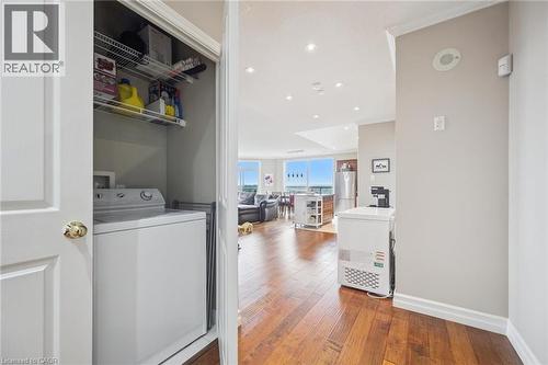 Washroom featuring washer / dryer, hardwood / wood-style floors, and recessed lighting - 255 Keats Way Unit# 1303, Waterloo, ON - Indoor Photo Showing Other Room