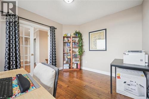 Office with wood-type flooring, a textured ceiling, and french doors - 255 Keats Way Unit# 1303, Waterloo, ON - Indoor