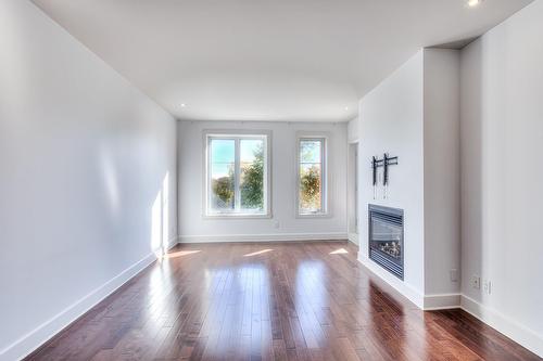 Living room - 301-1335 Rue Graveline, Laval (Sainte-Dorothée), QC - Indoor With Fireplace