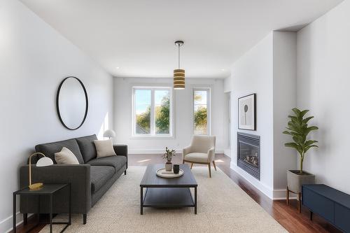 Living room - 301-1335 Rue Graveline, Laval (Sainte-Dorothée), QC - Indoor Photo Showing Living Room With Fireplace