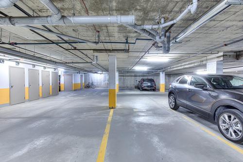 Parking - 301-1335 Rue Graveline, Laval (Sainte-Dorothée), QC - Indoor Photo Showing Garage