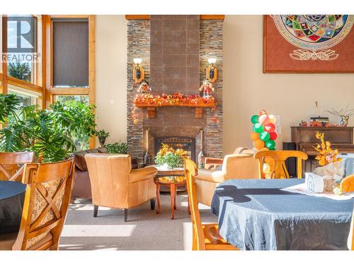 9100 Mackie Drive Unit# 212, Coldstream, BC - Indoor With Fireplace