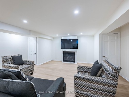 1013 Freeman Trail W, Milton, ON - Indoor Photo Showing Living Room With Fireplace
