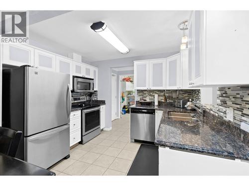 1964 Enterprise Way Unit# 403, Kelowna, BC - Indoor Photo Showing Kitchen With Stainless Steel Kitchen