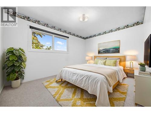 Virtually Staged - Upstairs Front Bedroom - 10212 Happy Valley Road, Summerland, BC - Indoor Photo Showing Bedroom