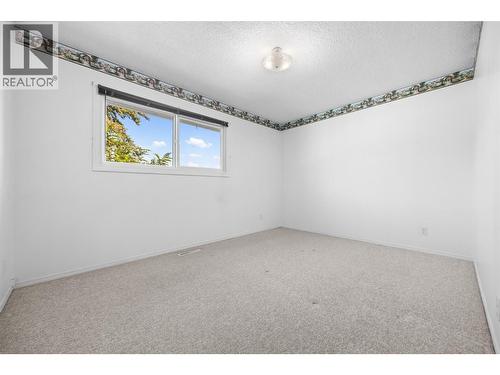 Upstairs front Bedroom - Unstaged - 10212 Happy Valley Road, Summerland, BC - Indoor Photo Showing Other Room