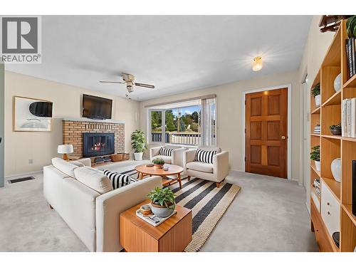 Virtually Staged - Upstairs Living Room - 10212 Happy Valley Road, Summerland, BC - Indoor Photo Showing Living Room With Fireplace