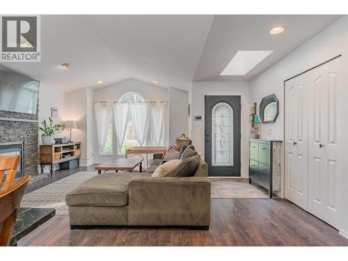 1518 3B Highway, Fruitvale, BC - Indoor Photo Showing Living Room With Fireplace