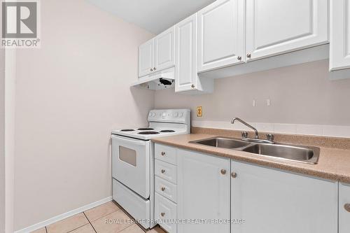 302 - 573 Armstrong Road, Kingston (East Gardiners Rd), ON - Indoor Photo Showing Kitchen With Double Sink