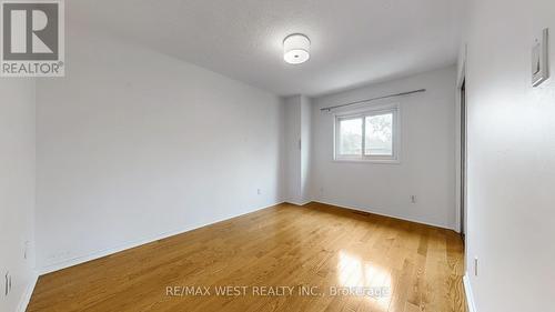 Bedroom With Oak Flooring & Mirror Closet Door - 7147 Harding Crescent, Mississauga, ON - Indoor Photo Showing Other Room