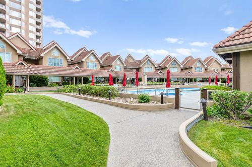 501-1152 Sunset Drive, Kelowna, BC - Outdoor With In Ground Pool With Facade