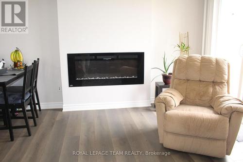135 Walleye Private, Ottawa, ON - Indoor Photo Showing Living Room With Fireplace