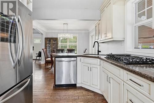 The Kitchen Impresses with Granite Countertops - 677 Greenwood Drive, Burlington, ON - Indoor Photo Showing Kitchen With Upgraded Kitchen