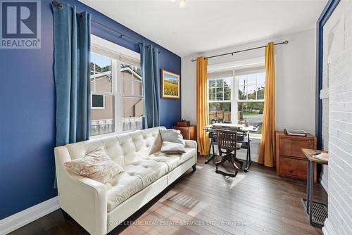 Den/Office Boasts a Painted Brick Accent Wall - 677 Greenwood Drive, Burlington, ON - Indoor