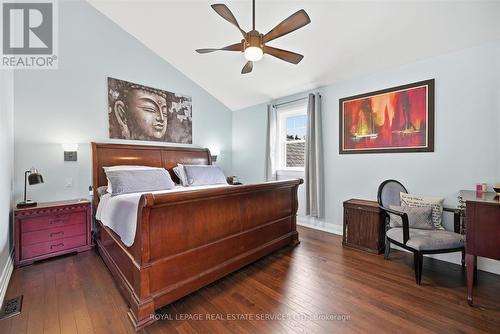 Primary Bedroom Boasts a Dramatic Lofted Ceiling - 677 Greenwood Drive, Burlington, ON - Indoor Photo Showing Bedroom