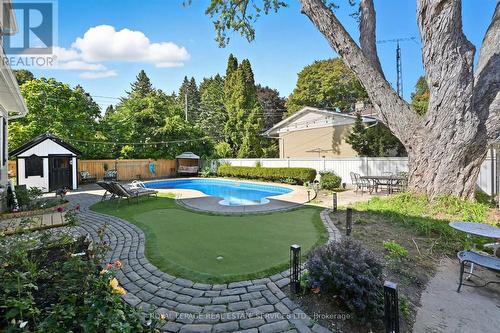 Private Backyard Features a Kidney-Shaped Pool - 677 Greenwood Drive, Burlington, ON - Outdoor With In Ground Pool With Backyard