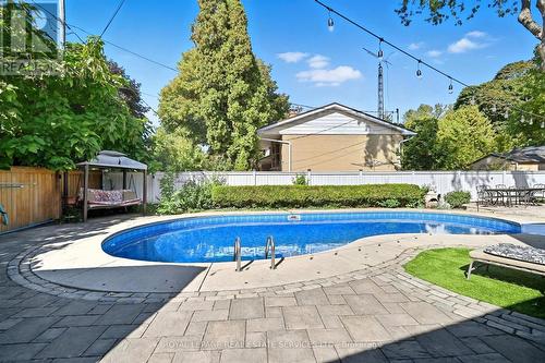 Private Backyard Features a Kidney-Shaped Pool - 677 Greenwood Drive, Burlington, ON - Outdoor With In Ground Pool With Deck Patio Veranda With Backyard