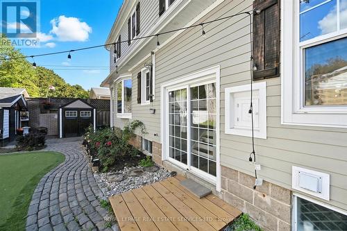 Beautifully Landscaped with an Interlock Walkway - 677 Greenwood Drive, Burlington, ON - Outdoor With Deck Patio Veranda