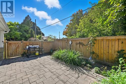 Enjoy a Fully Fenced Backyard with Stone Patio - 677 Greenwood Drive, Burlington, ON - Outdoor With Deck Patio Veranda