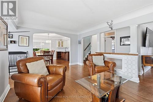 Living Room w/Electric Fireplace and Warm Finishes - 677 Greenwood Drive, Burlington, ON - Indoor Photo Showing Living Room