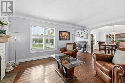 Living Room w/Electric Fireplace and Warm Finishes - 677 Greenwood Drive, Burlington, ON - Indoor Photo Showing Living Room