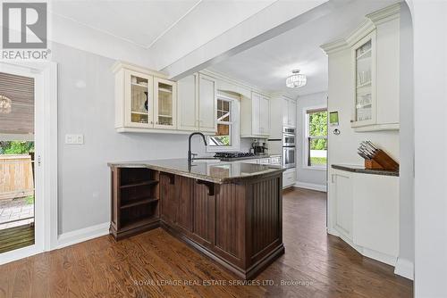 The Kitchen Impresses with Granite Countertops - 677 Greenwood Drive, Burlington, ON - Indoor Photo Showing Kitchen