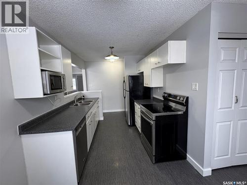 138 Thomson Avenue, Regina, SK - Indoor Photo Showing Kitchen With Double Sink