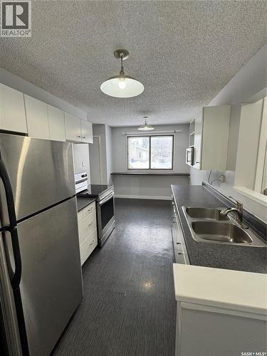 138 Thomson Avenue, Regina, SK - Indoor Photo Showing Kitchen With Double Sink