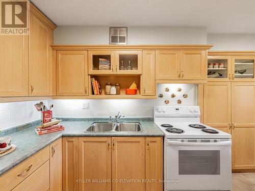 Loads Of Storage & Prep Space - 308 - 250 Scarlett Road, Toronto, ON - Indoor Photo Showing Kitchen With Double Sink